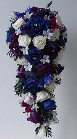 A gorgeous cascade bridal bouquet made with preserved royal blue purple and