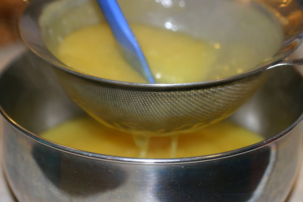 Straining the thickened curd Straining the thickened curd